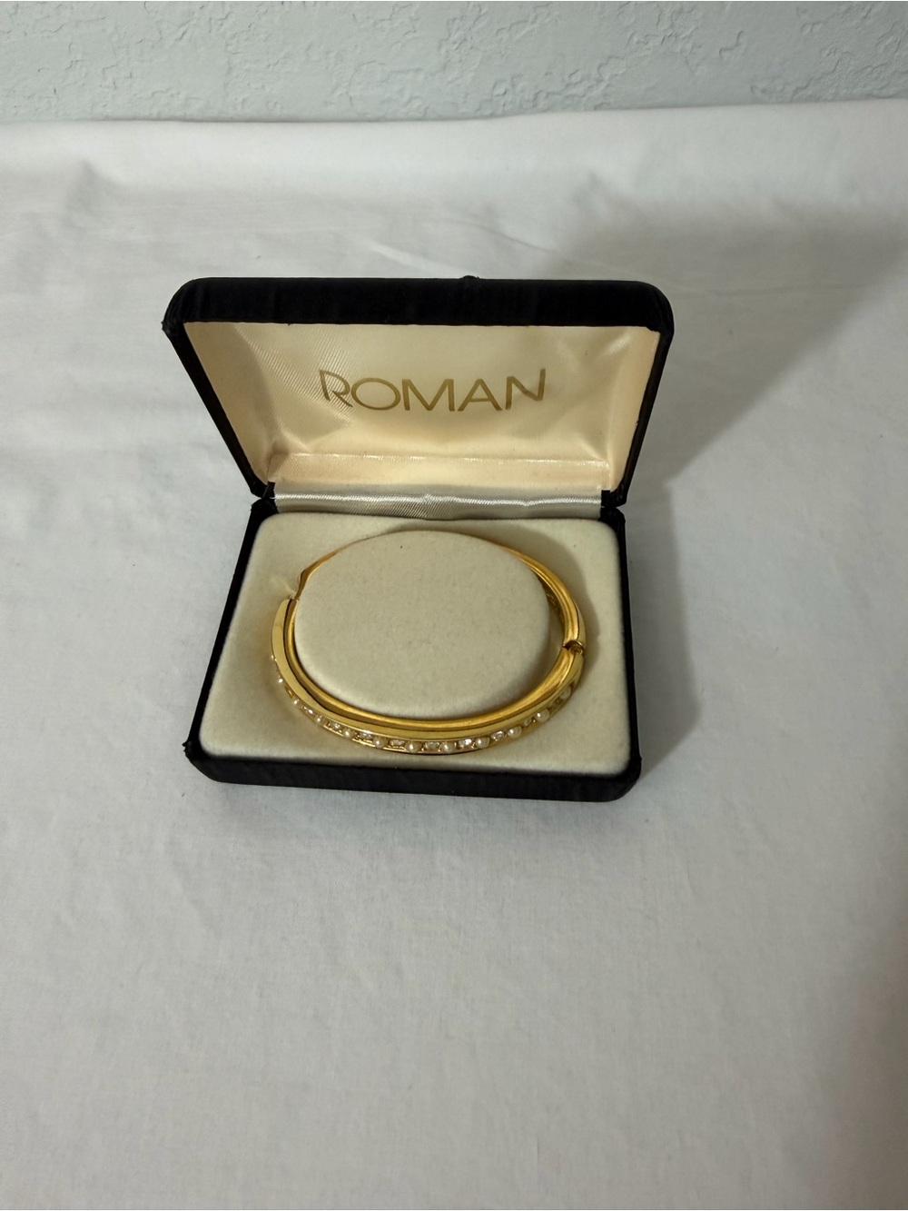 Roman Gold-Tone Bangle Bracelet with Crystal Accents